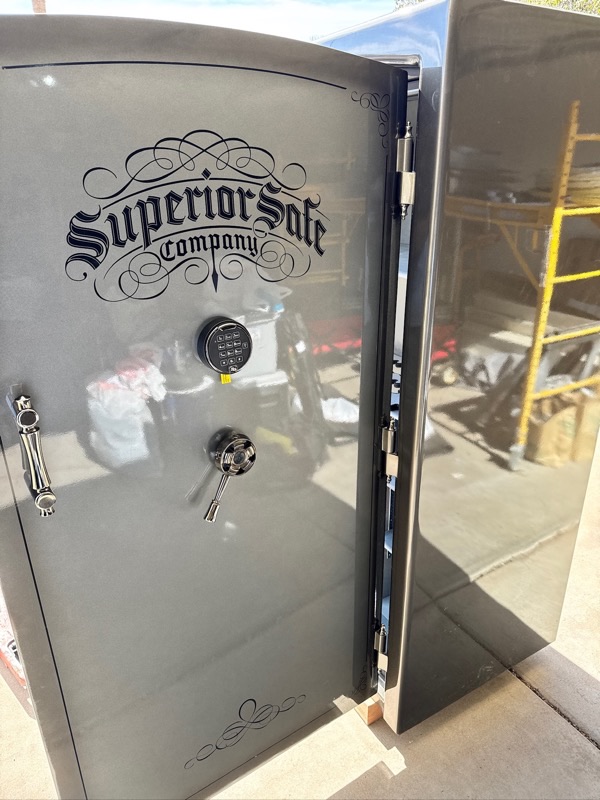 Superior Safe Company gun safe with door open showing heavy-duty locking bolts